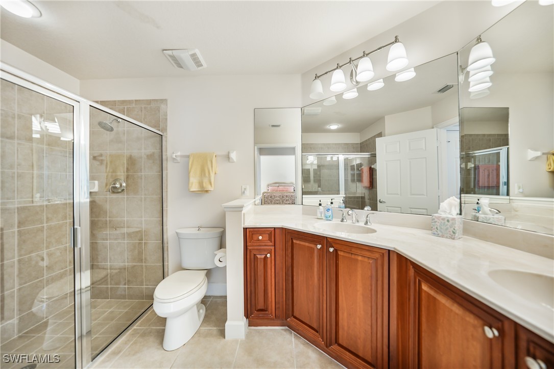 17084 Acapulco Road, Unit 211 Punta Gorda, FL 33955 - Photo 10 of 45 a bathroom with a sink a toilet and shower