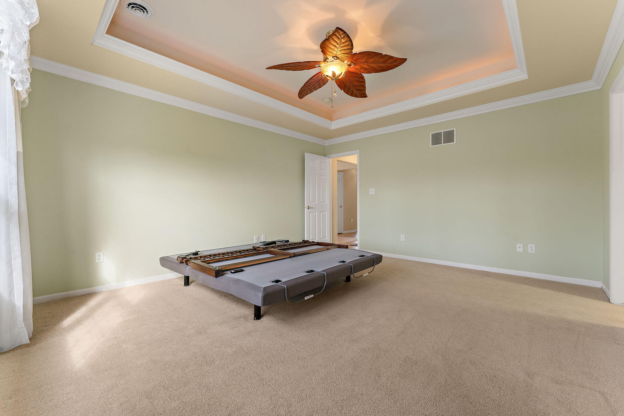 901 Veterans Lane Crown Point, IN 46307 - Photo 17 of 40 a room with gym equipment and a ceiling fan