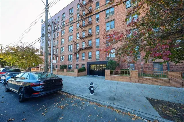 a backyard of a house with barbeque oven table and chairs