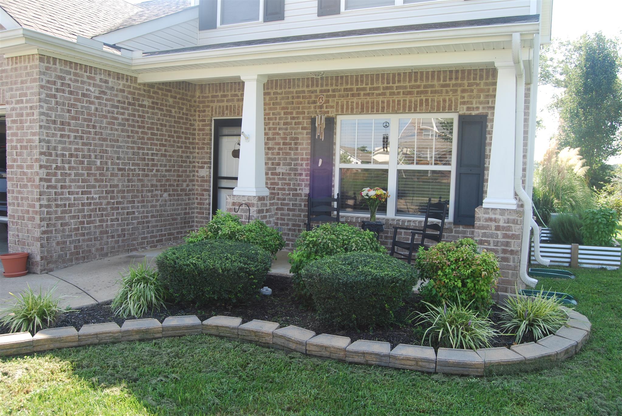 6003 Chickadee Circle Spring Hill, TN 37174 - Photo 3 of 23 a view of a house with a small yard and plants