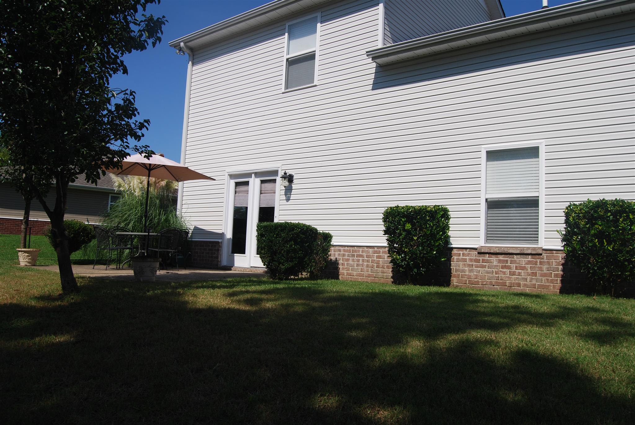 6003 Chickadee Circle Spring Hill, TN 37174 - Photo 21 of 23 a view of a house with backyard and sitting area