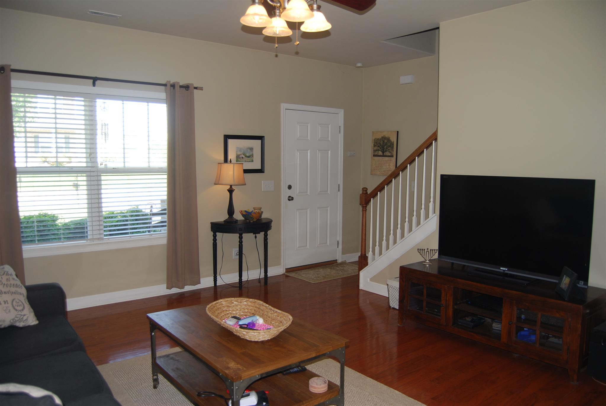 6003 Chickadee Circle Spring Hill, TN 37174 - Photo 4 of 23 a living room with furniture and a flat screen tv