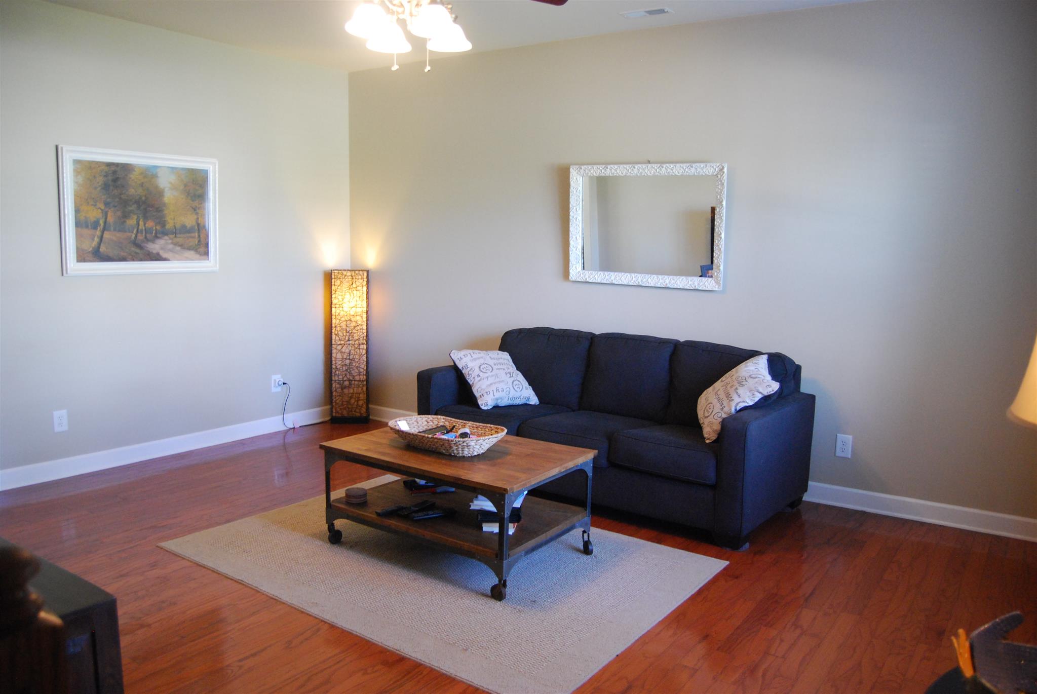 6003 Chickadee Circle Spring Hill, TN 37174 - Photo 5 of 23 a living room with furniture and a wooden floor