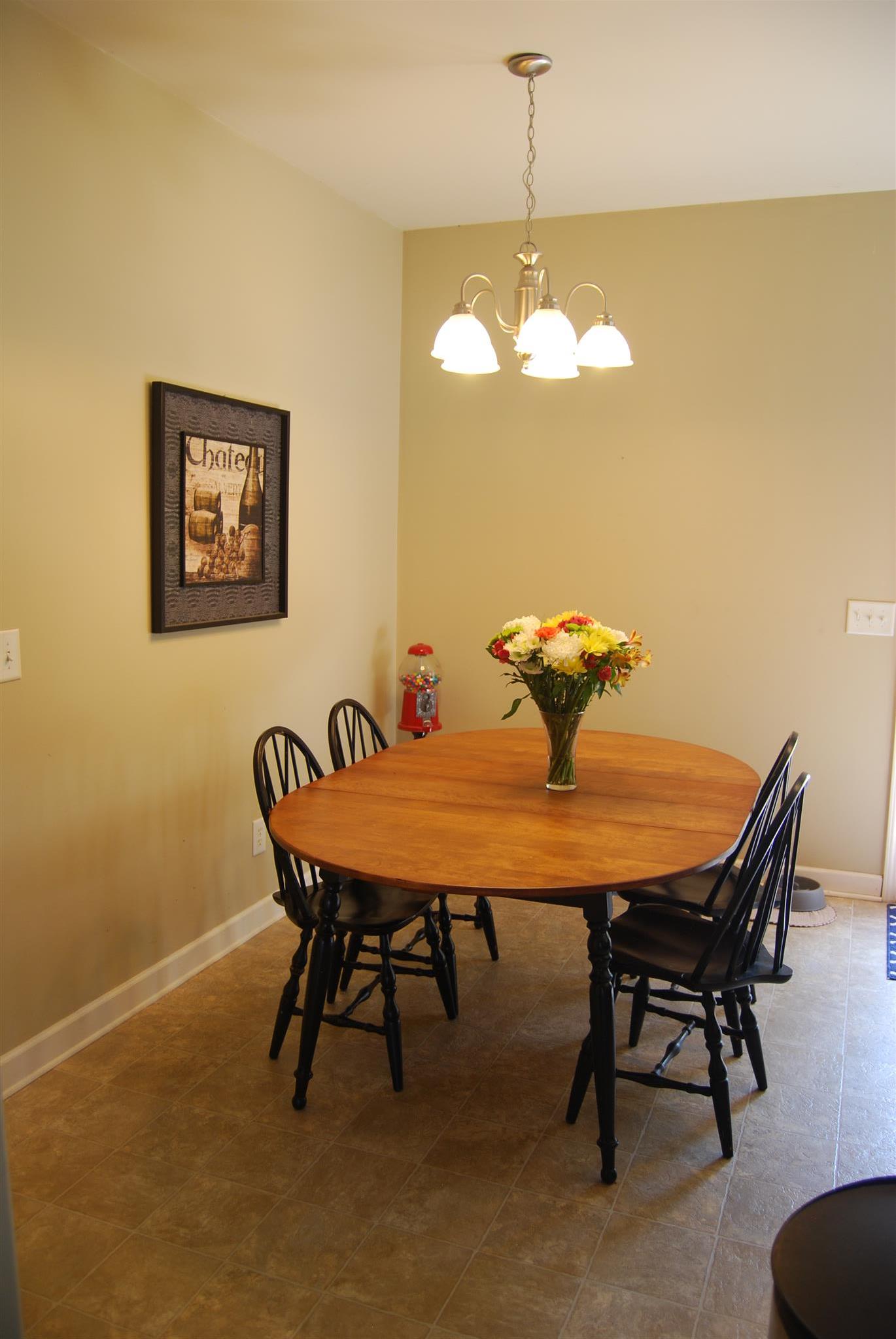 6003 Chickadee Circle Spring Hill, TN 37174 - Photo 7 of 23 a view of a dining room with furniture and chandelier