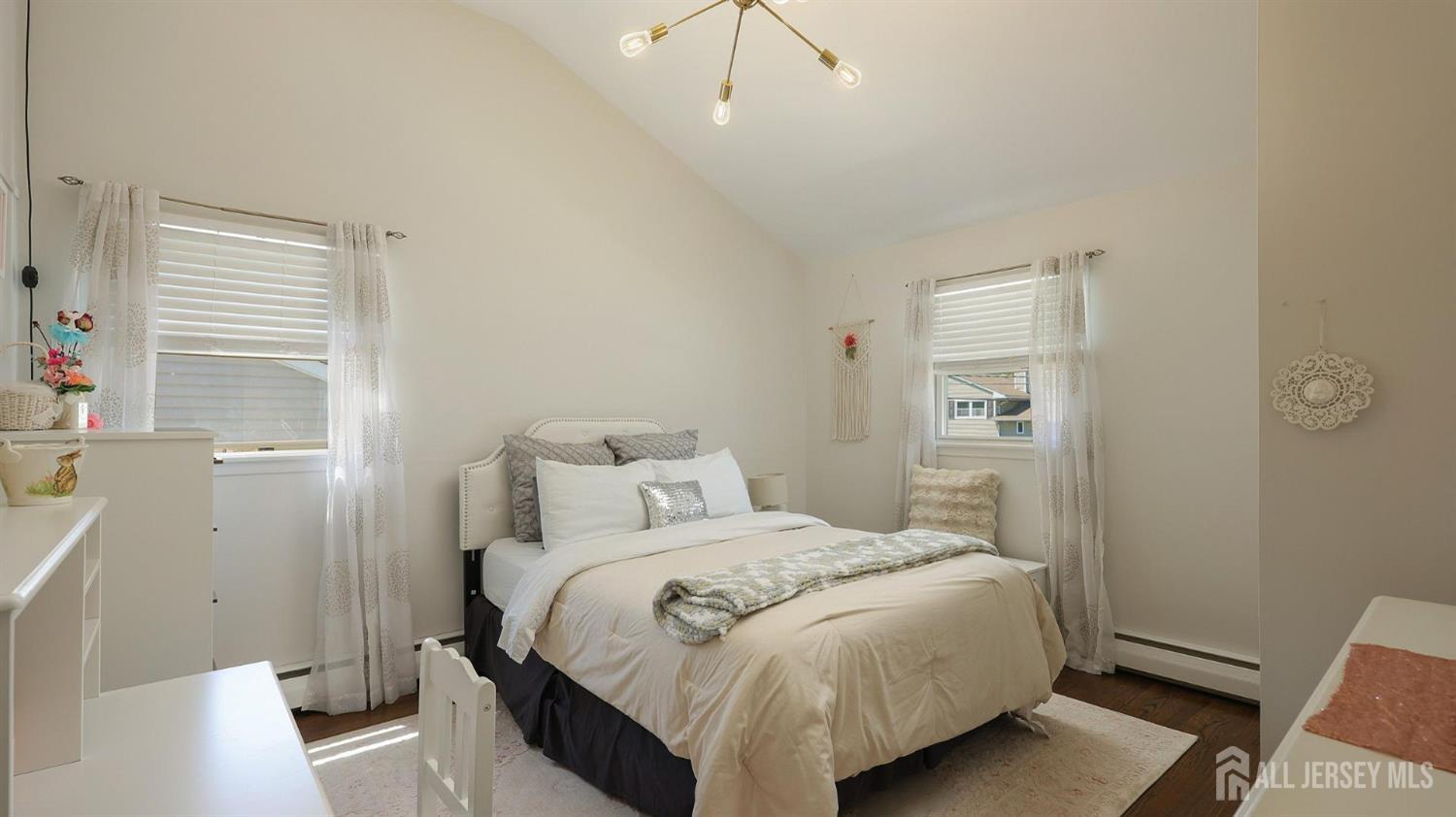 47 Miliken Road Colonia, NJ 07067 - Photo 27 of 40 a bedroom with a bed and a window