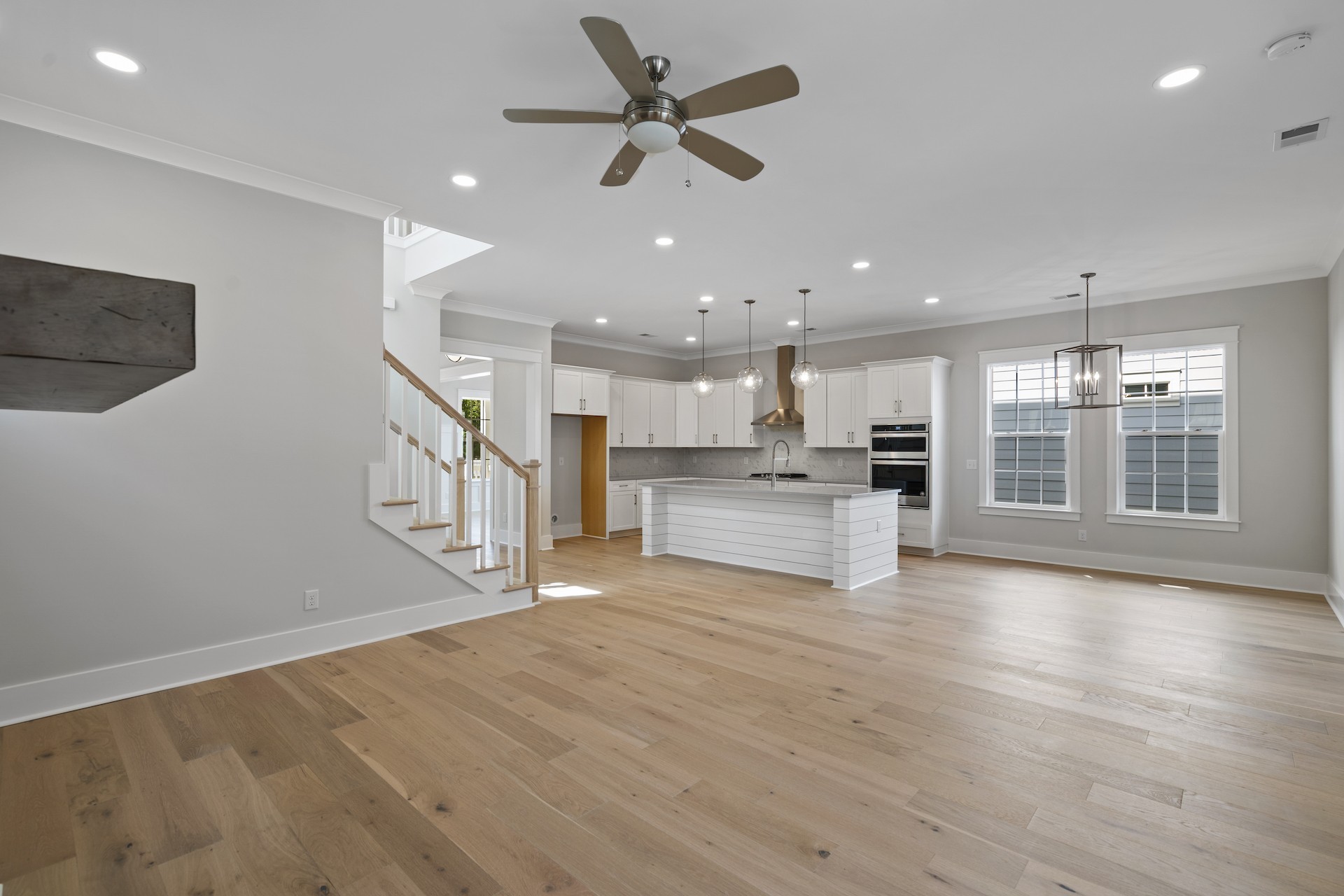 463 Dewar Drive Franklin, TN 37064 - Photo 13 of 31 a view of an empty room with wooden floor and a kitchen
