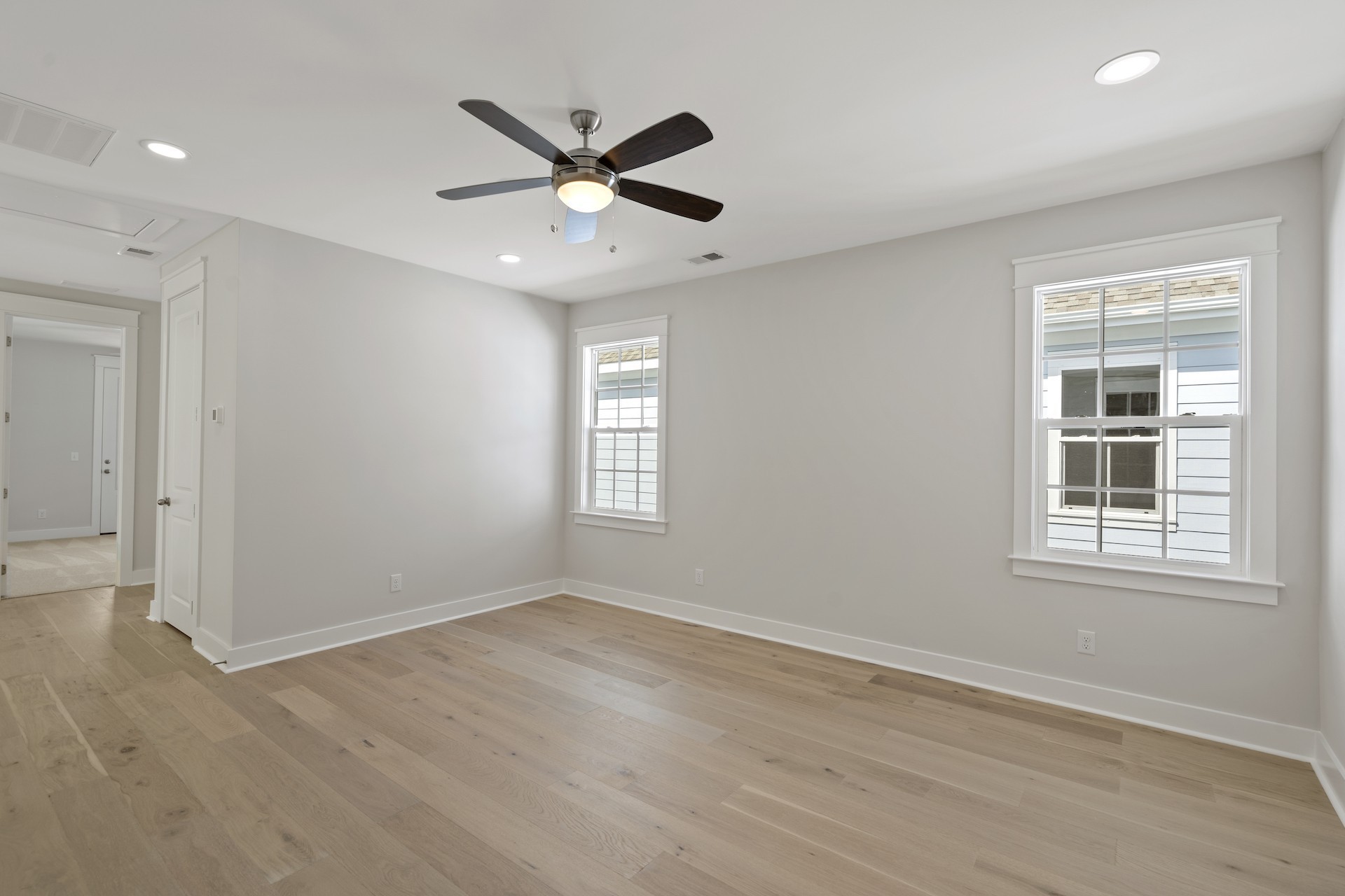 463 Dewar Drive Franklin, TN 37064 - Photo 26 of 31 an empty room with wooden floor fan and windows