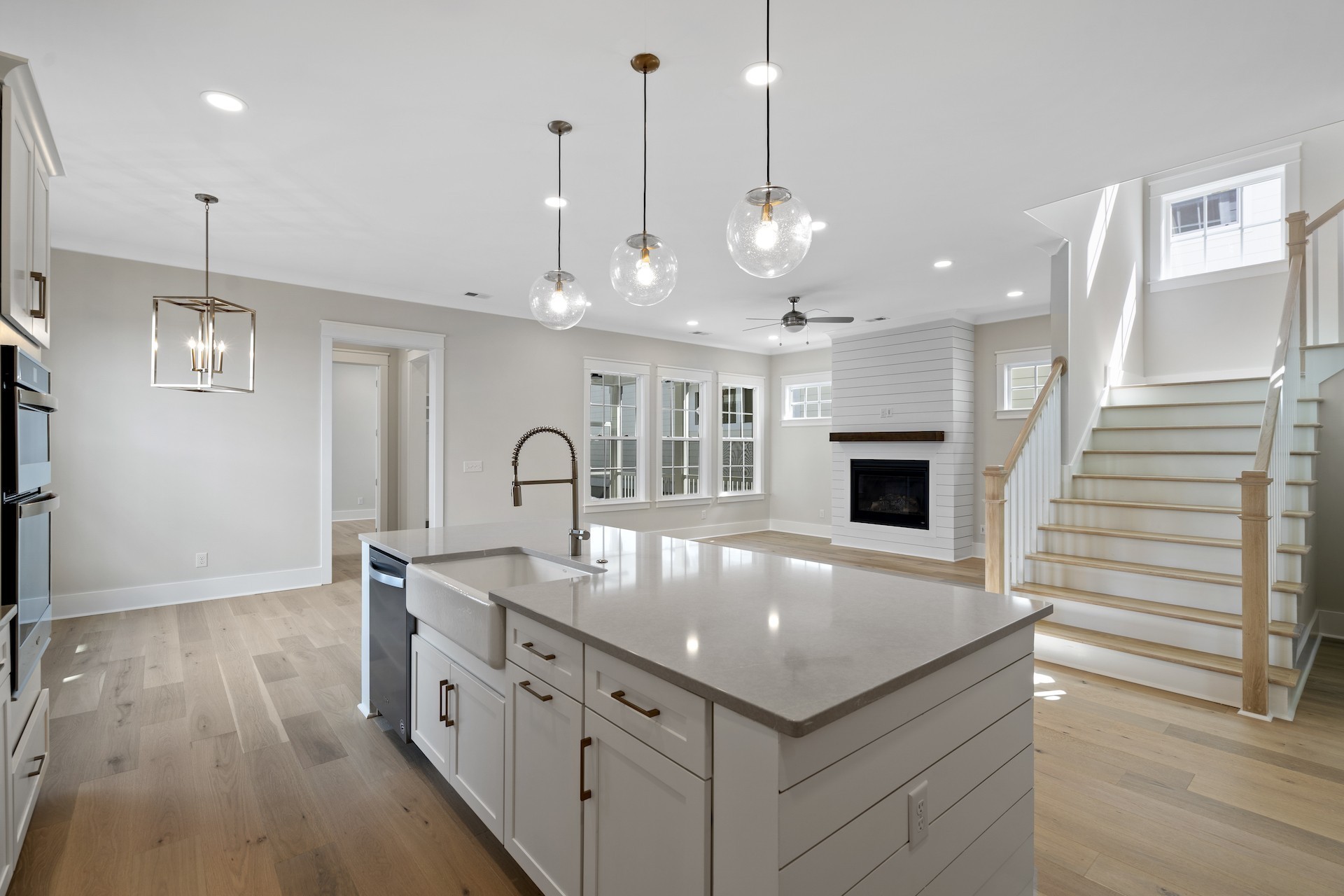 463 Dewar Drive Franklin, TN 37064 - Photo 9 of 31 a large kitchen with kitchen island a stove a sink a center island and wooden floor