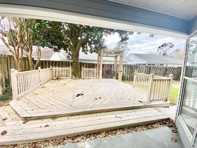 a view of a living room and balcony