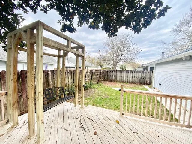 a view of backyard with a swimming pool