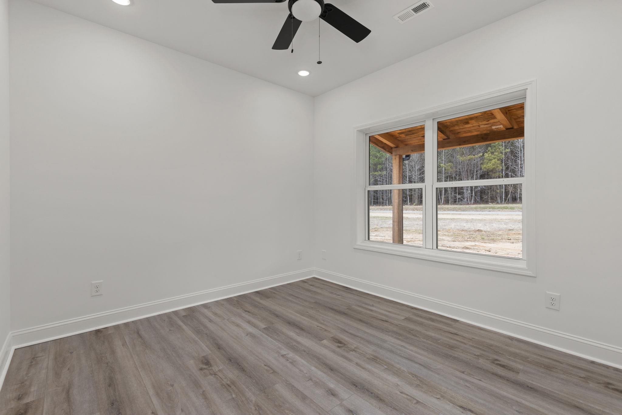 458 County Road 514 Rienzi, MS 38865 - Photo 12 of 34 an empty room with a window and a ceiling fan