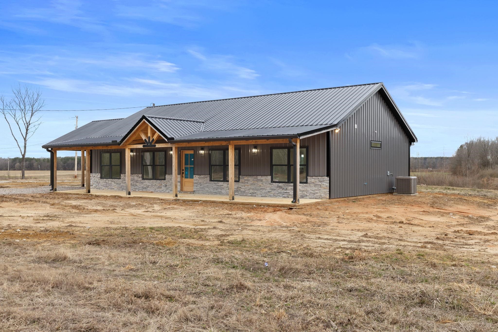 458 County Road 514 Rienzi, MS 38865 - Photo 3 of 34 a front view of a house with a garden