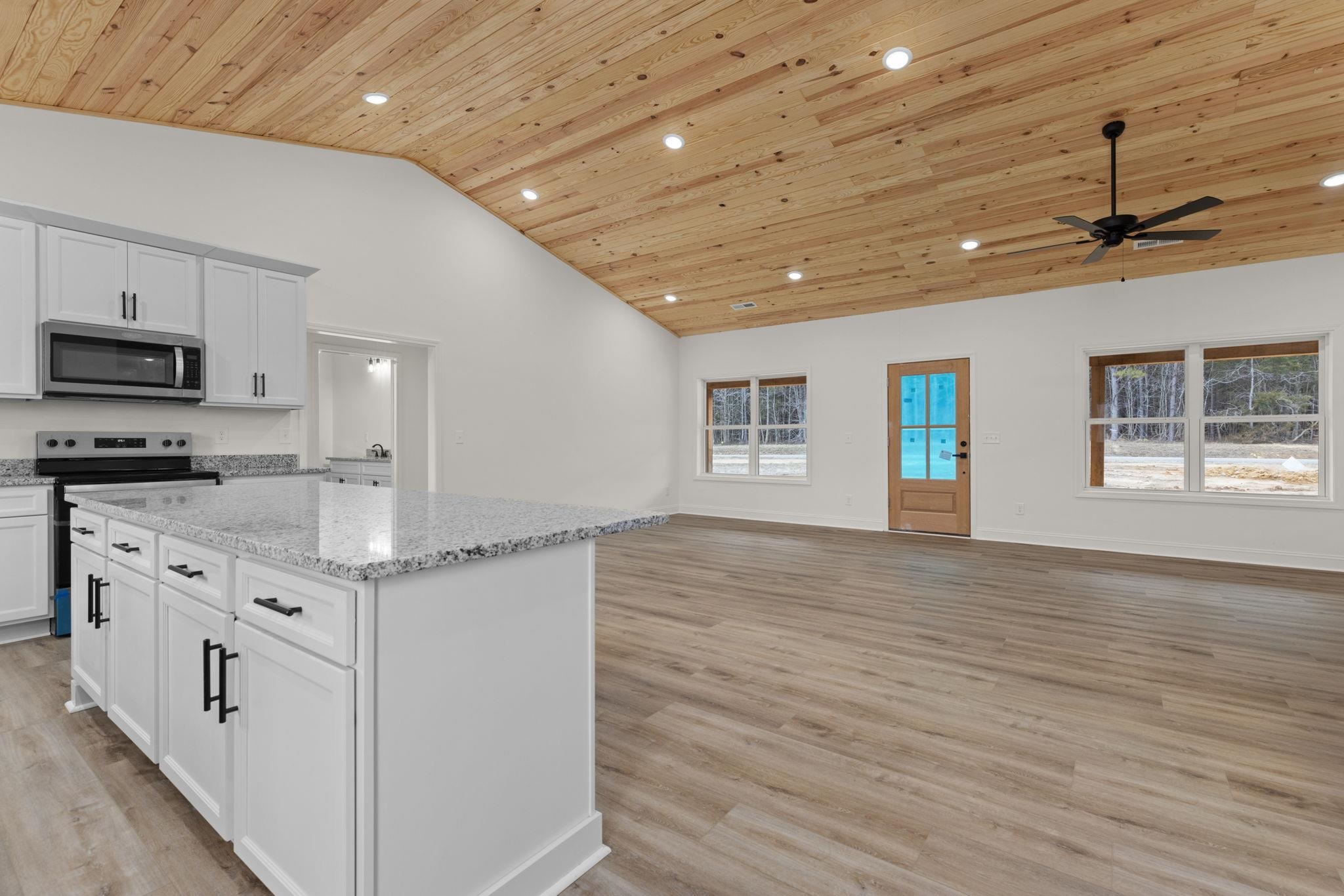 458 County Road 514 Rienzi, MS 38865 - Photo 34 of 34 a kitchen with granite countertop a stove and a sink