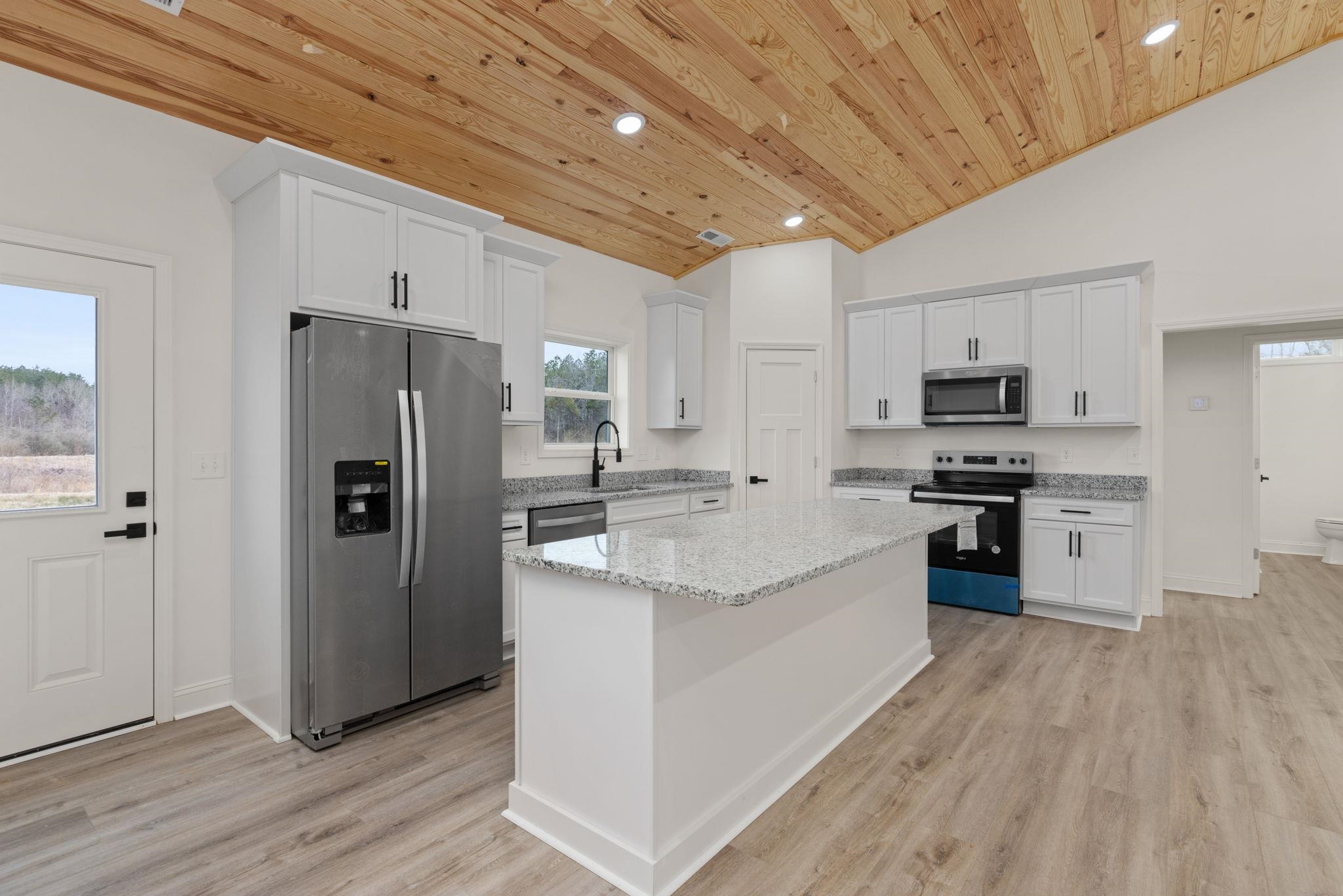 458 County Road 514 Rienzi, MS 38865 - Photo 4 of 34 a large kitchen with a center island stainless steel appliances and cabinets