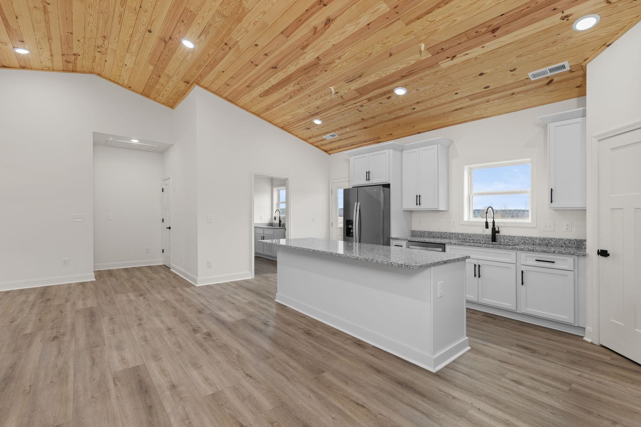 458 County Road 514 Rienzi, MS 38865 - Photo 6 of 34 a large kitchen with stainless steel appliances granite countertop a sink and cabinets