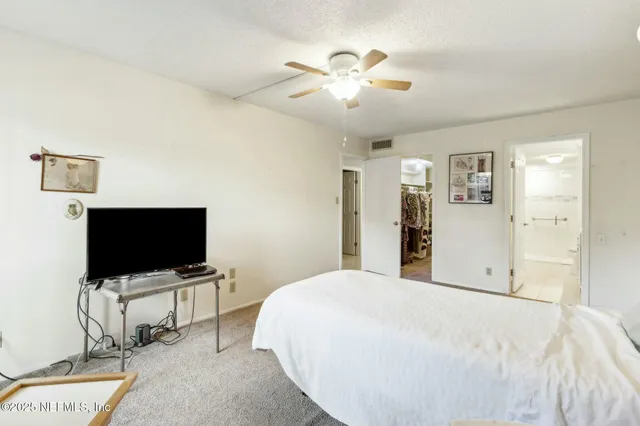 a bathroom with a sink a shower a mirror and a bathtub