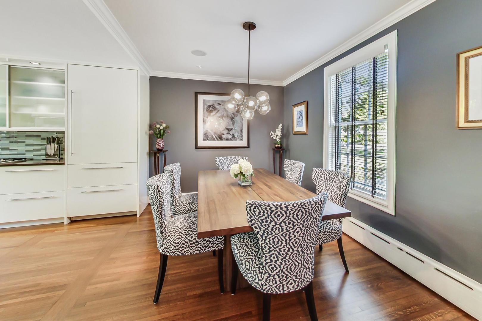 385 Washington Avenue Glencoe, IL 60022 - Photo 12 of 50 a view of a dining room with furniture window and wooden floor