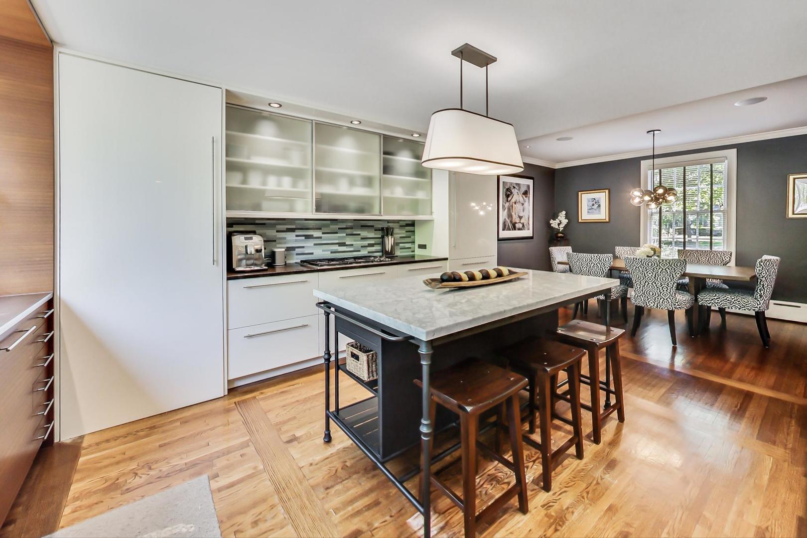 385 Washington Avenue Glencoe, IL 60022 - Photo 13 of 50 a view of a dining room with furniture window and wooden floor