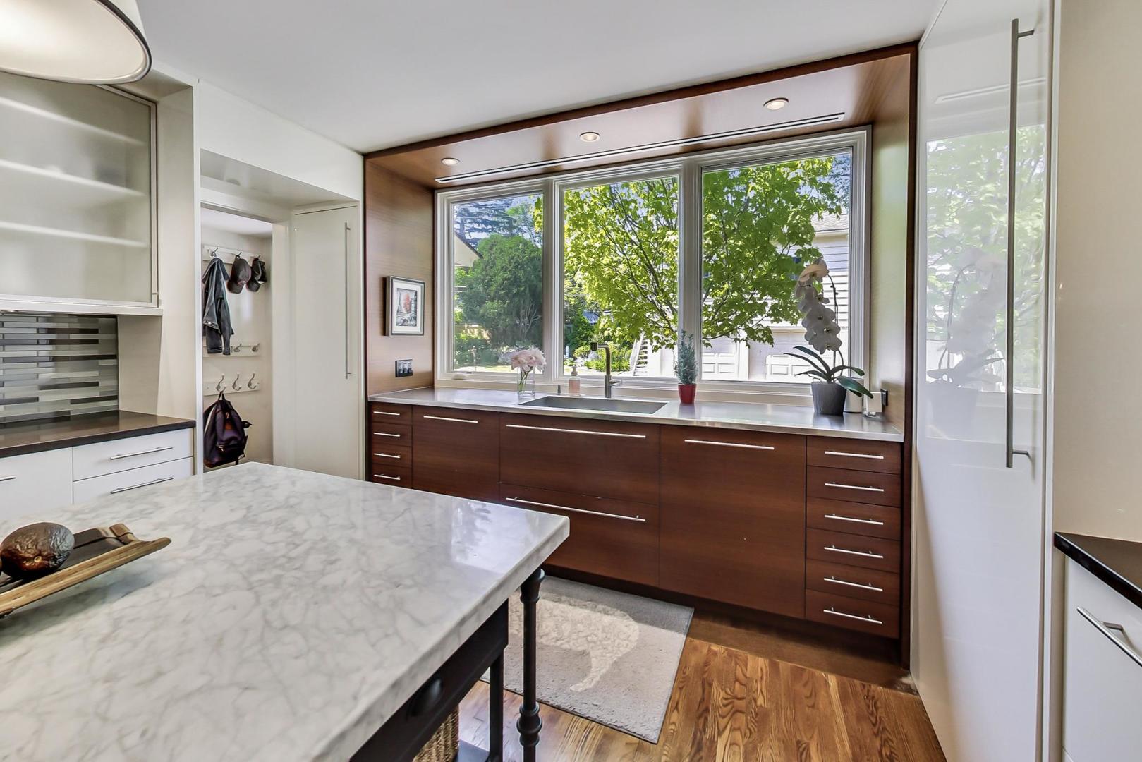 385 Washington Avenue Glencoe, IL 60022 - Photo 14 of 50 a living room with kitchen island furniture and a floor to ceiling window
