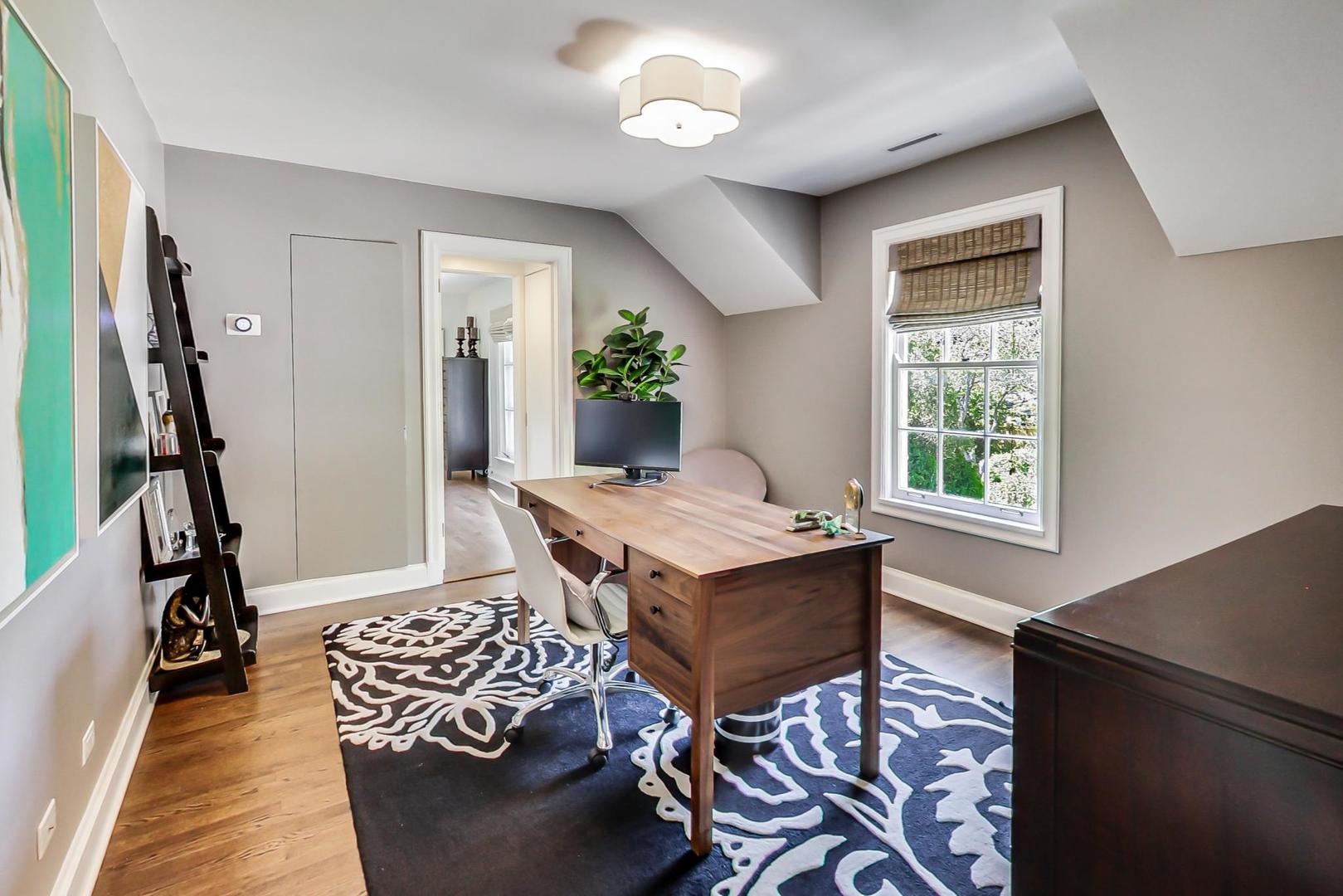 385 Washington Avenue Glencoe, IL 60022 - Photo 17 of 50 a living room with furniture and a window