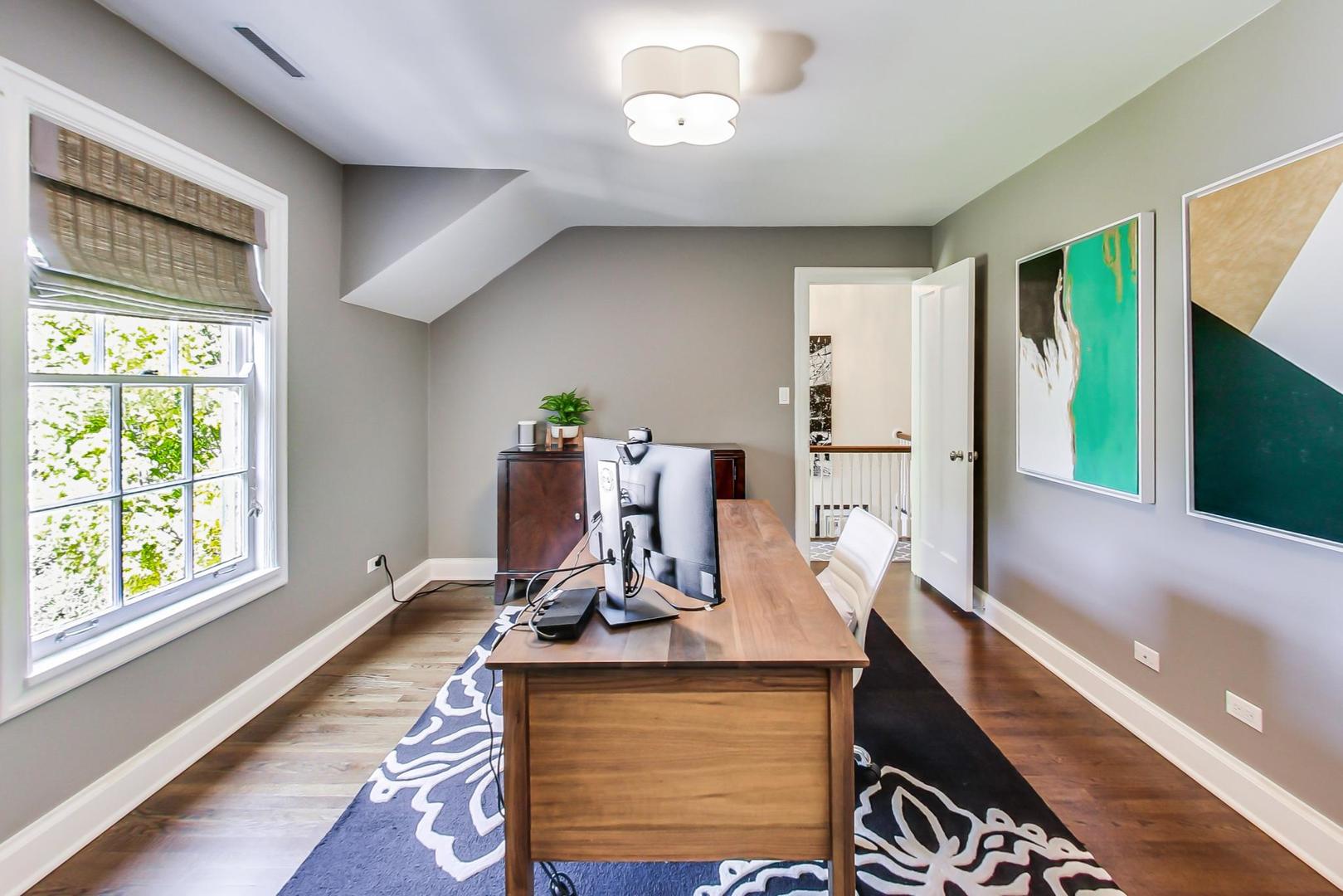 385 Washington Avenue Glencoe, IL 60022 - Photo 18 of 50 a room with gym equipment and large windows