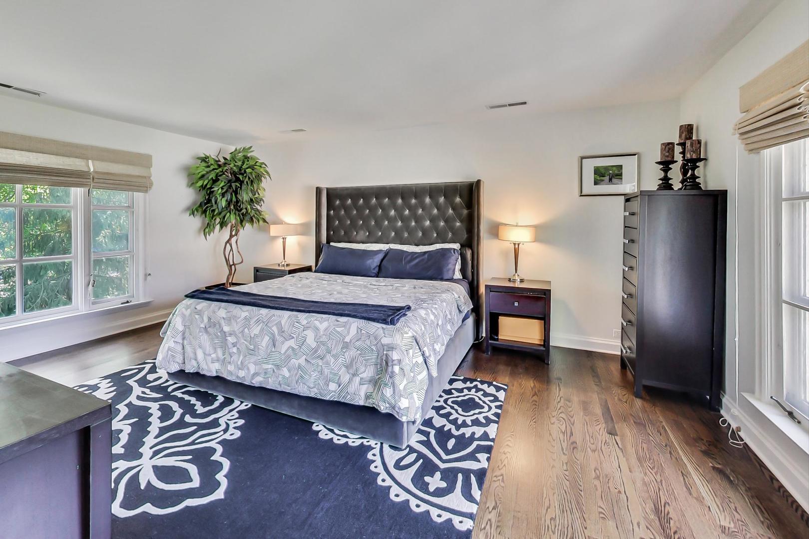 385 Washington Avenue Glencoe, IL 60022 - Photo 19 of 50 a bedroom with a bed and a window