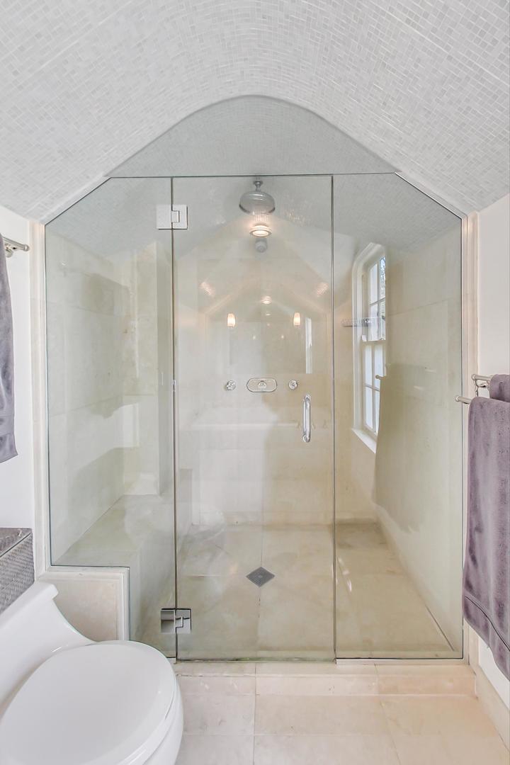 385 Washington Avenue Glencoe, IL 60022 - Photo 23 of 50 a bathroom with a shower a toilet and a sink