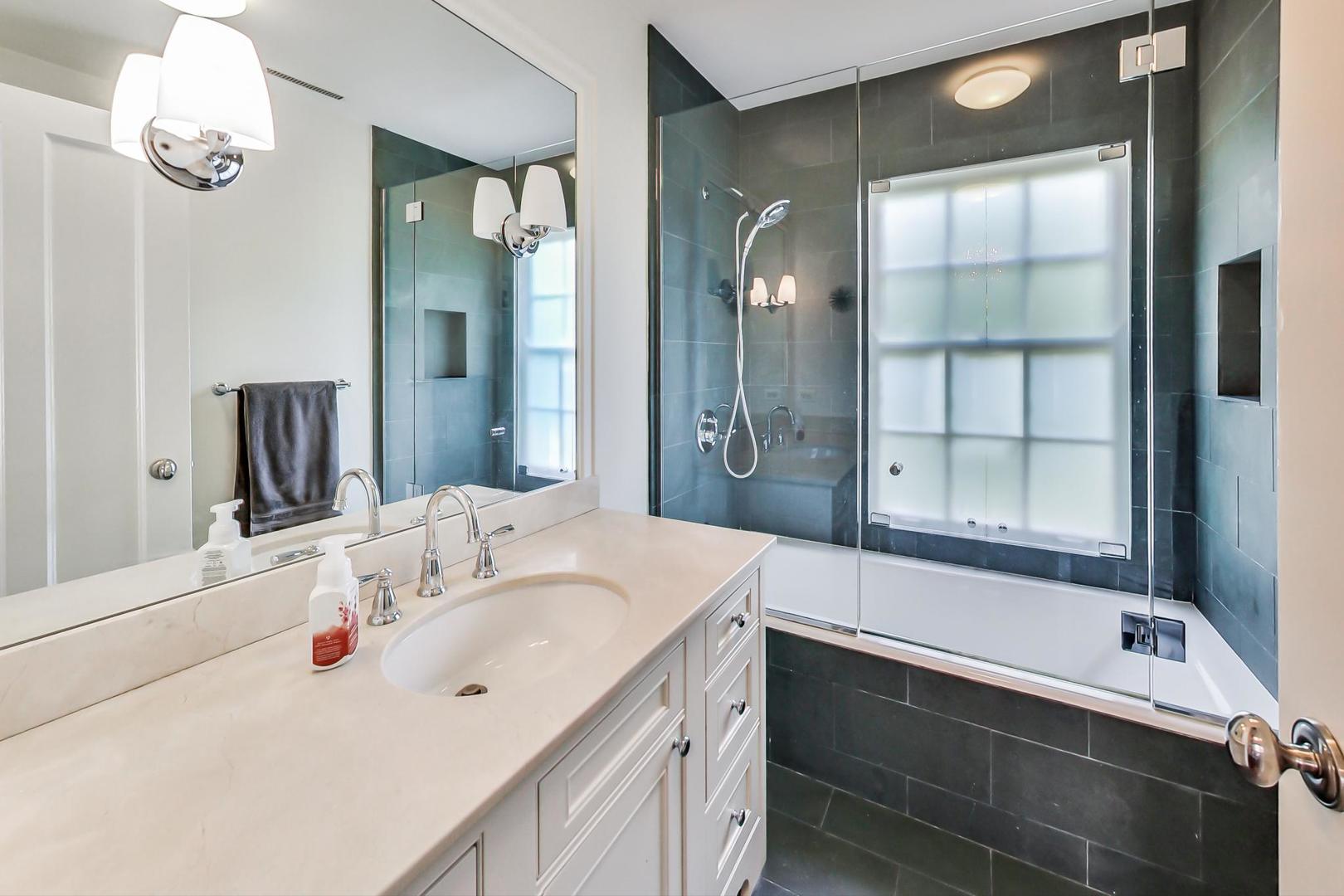 385 Washington Avenue Glencoe, IL 60022 - Photo 28 of 50 a bathroom with a sink double vanity and a mirror