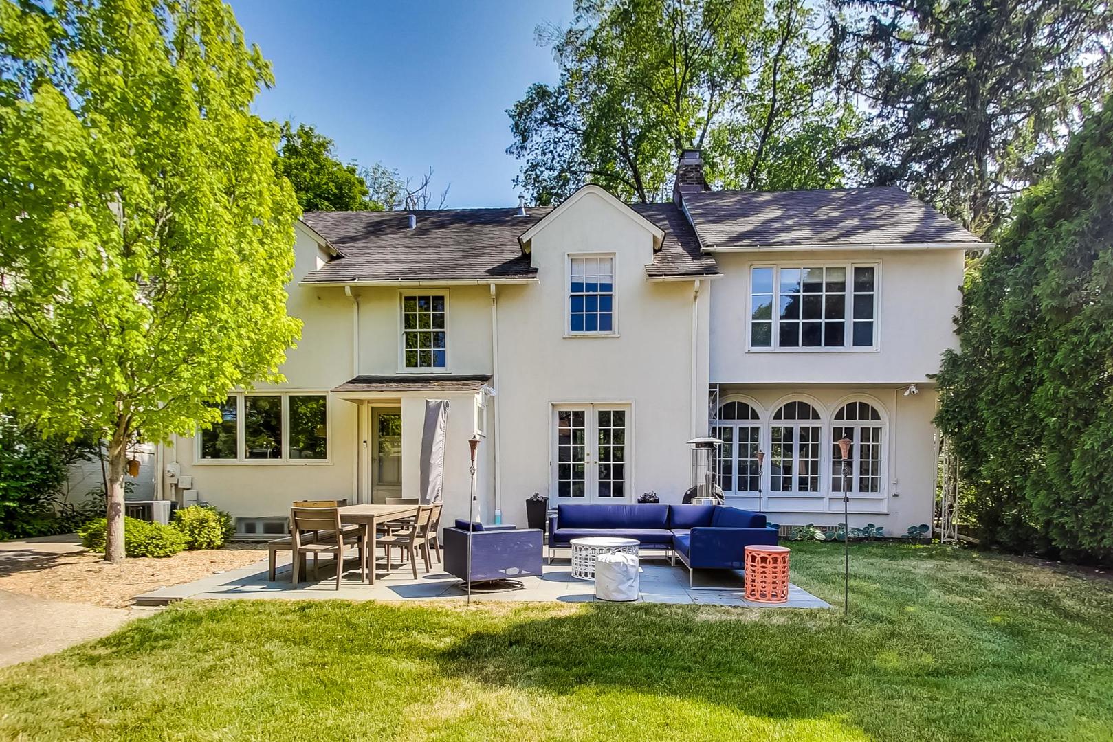 385 Washington Avenue Glencoe, IL 60022 - Photo 39 of 50 a view of a house with a yard patio and fire pit