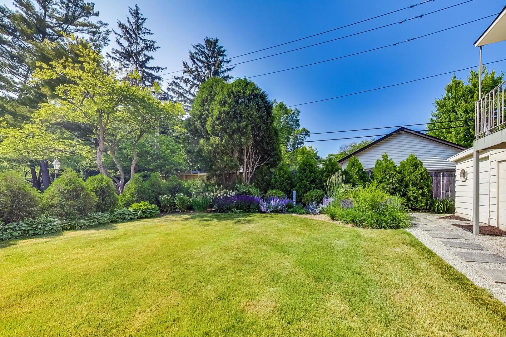 385 Washington Avenue Glencoe, IL 60022 - Photo 42 of 50 a view of a backyard with a garden