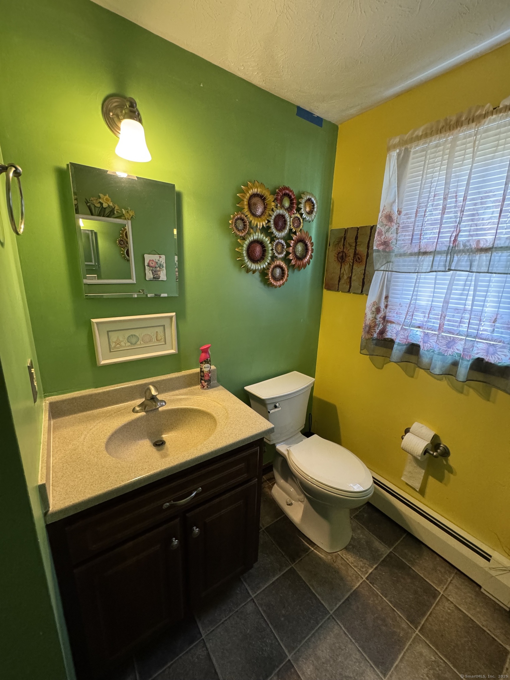 67 Royal Oak Circle Meriden, CT 06450 - Photo 14 of 25 a bathroom with a sink mirror vanity and toilet