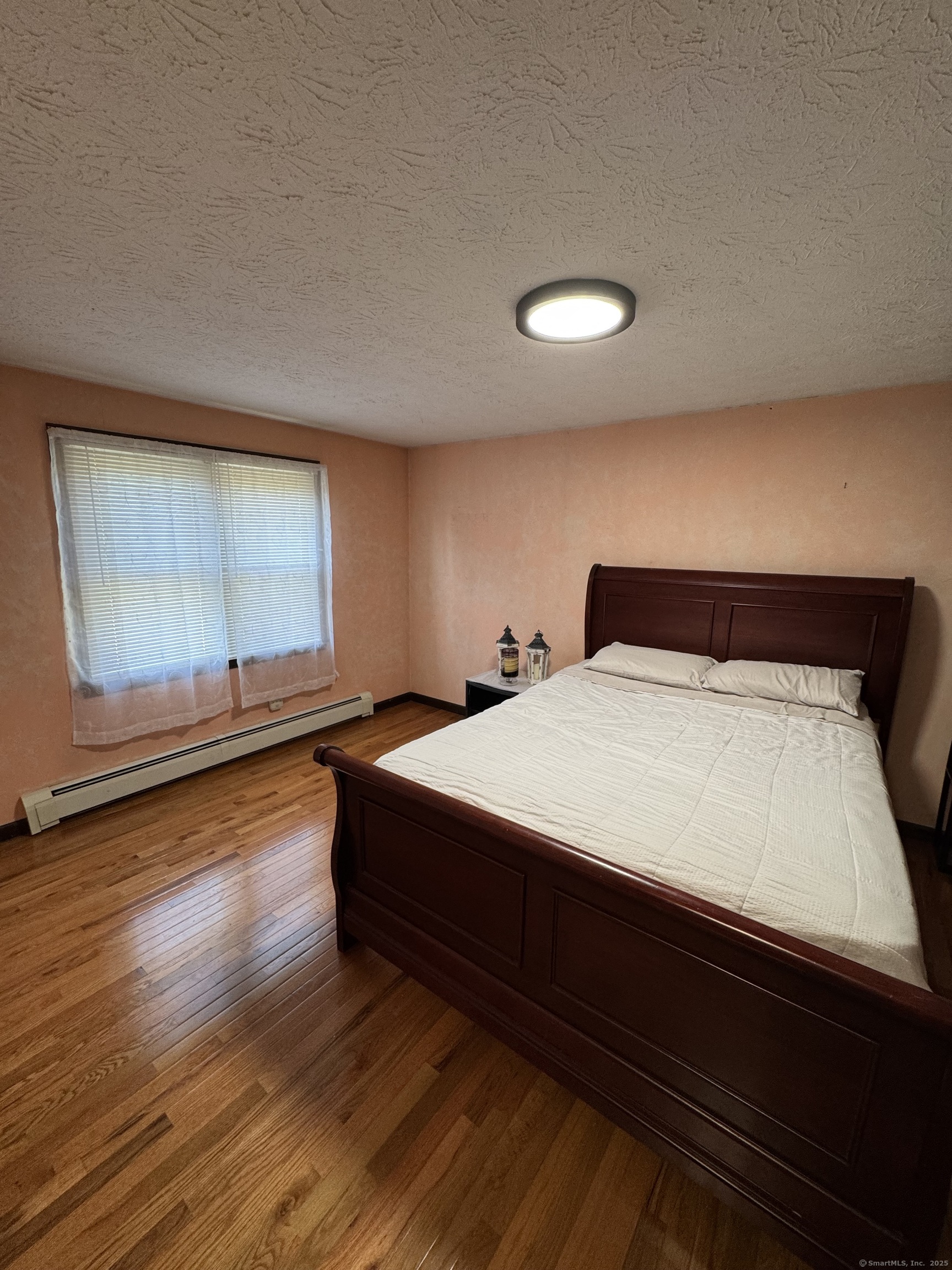 67 Royal Oak Circle Meriden, CT 06450 - Photo 18 of 25 a bedroom with a bed and window