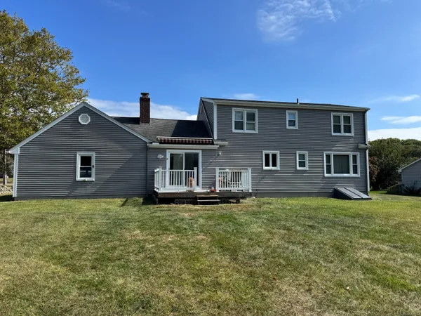 a house that has a big yard in front of it
