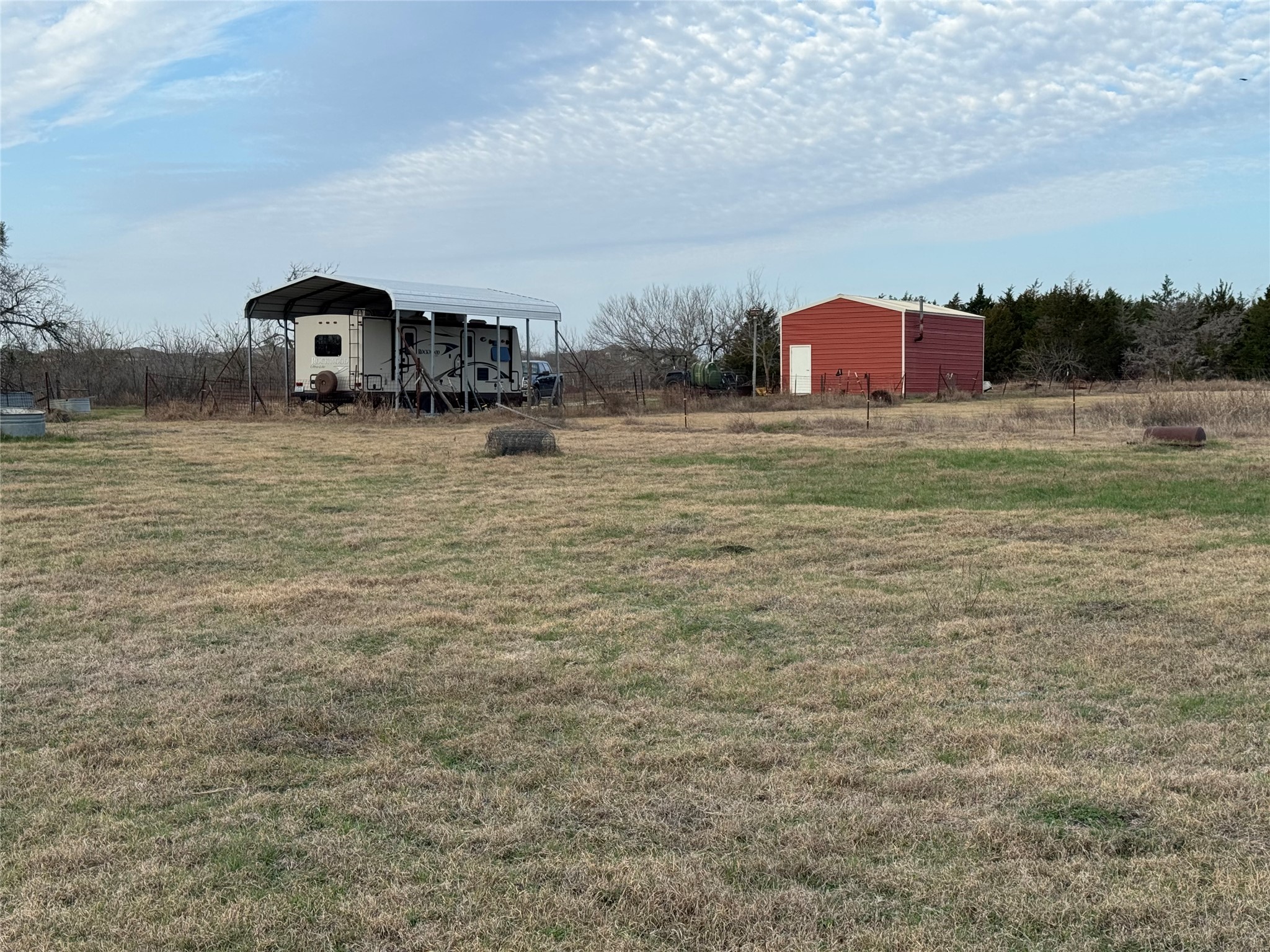 14831 Bois-D-Arc Road, Unit 10 Manor, TX 78653 - Photo 10 of 17 View of grassy yard with a detached carport and an outdoor structure