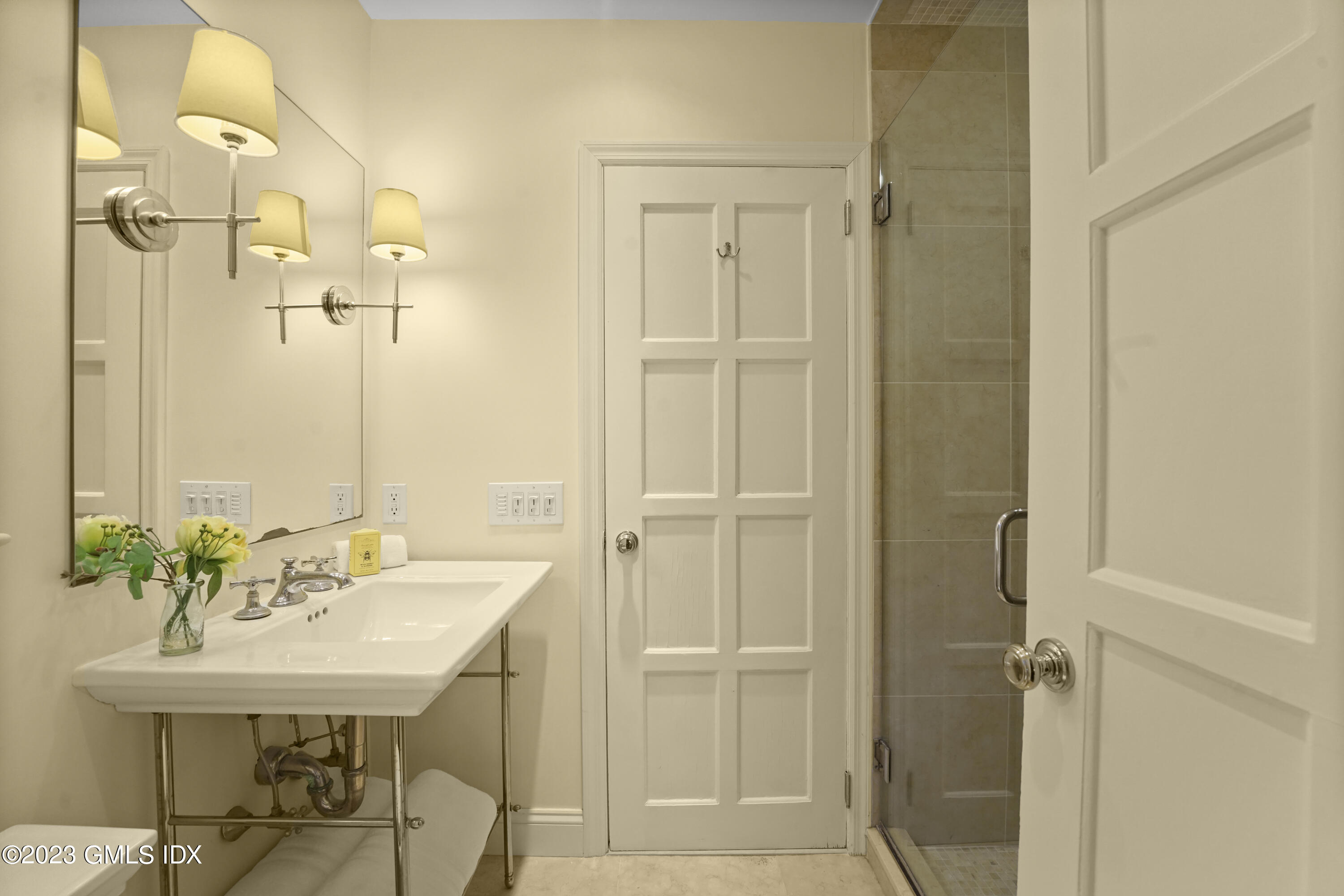 7 Gilliam Lane Riverside, CT 06878 - Photo 27 of 42 a bathroom with a sink shower and a mirror