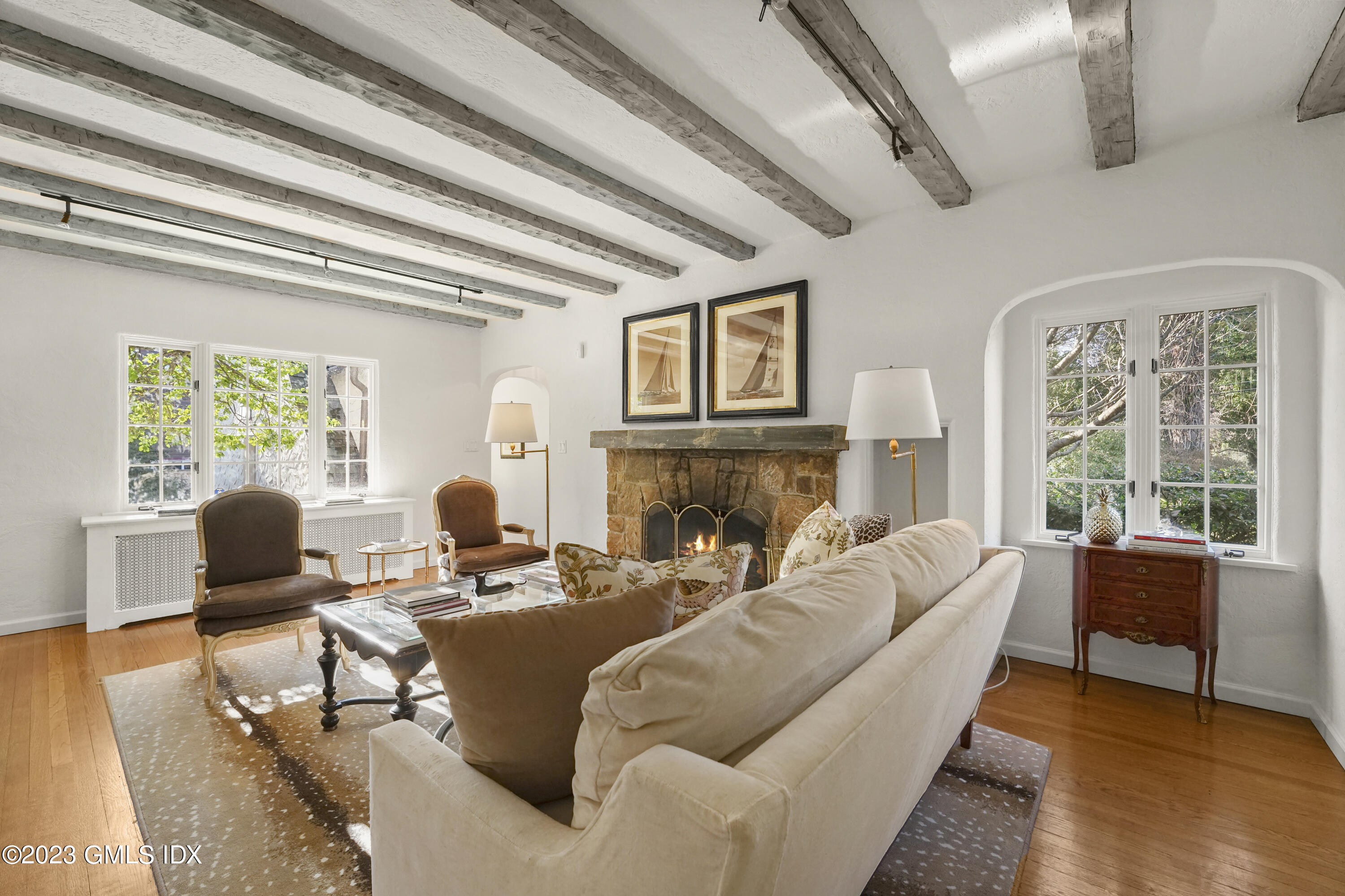 7 Gilliam Lane Riverside, CT 06878 - Photo 5 of 42 a living room with fireplace furniture and a large window