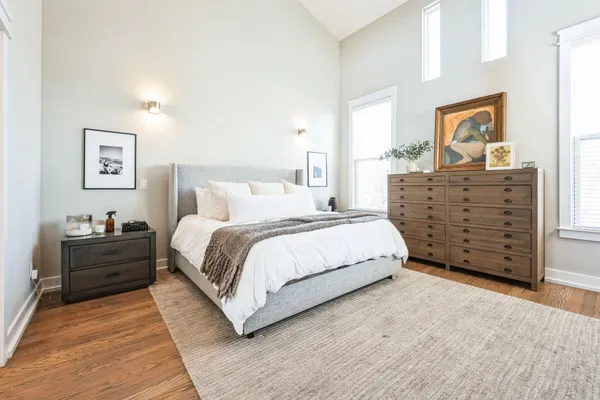 a bedroom with a bed and a dresser