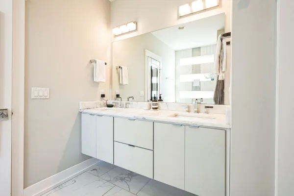 a bathroom with a sink and a mirror