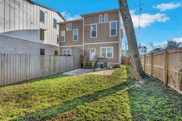 a view of a backyard with pathway