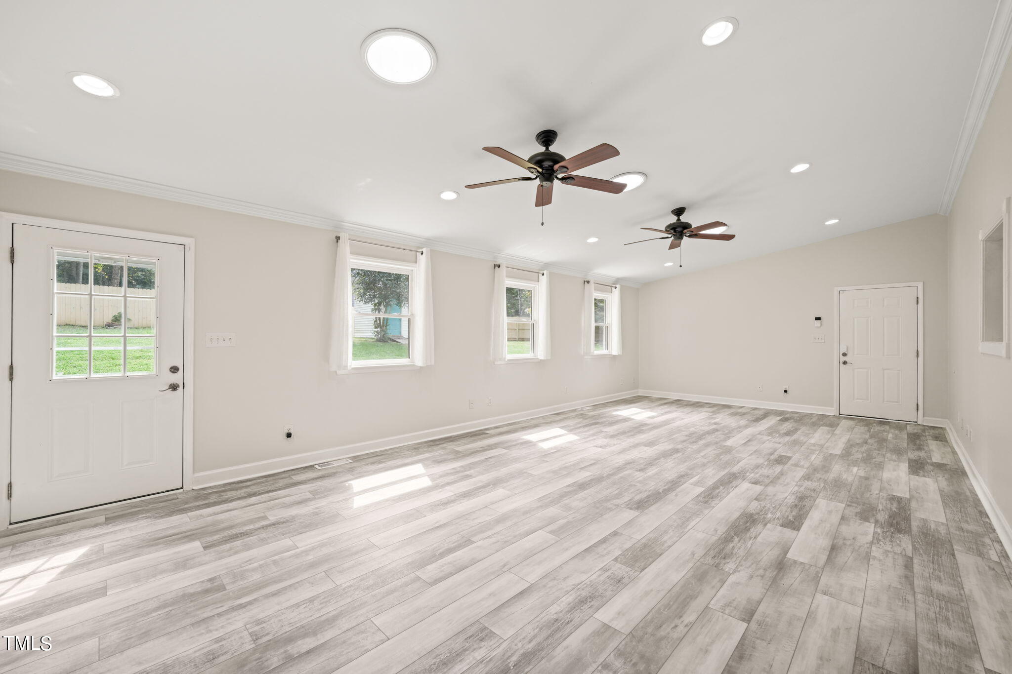 2835 Fox Drive Durham, NC 27712 - Photo 14 of 53 a view of empty room with wooden floor and fan