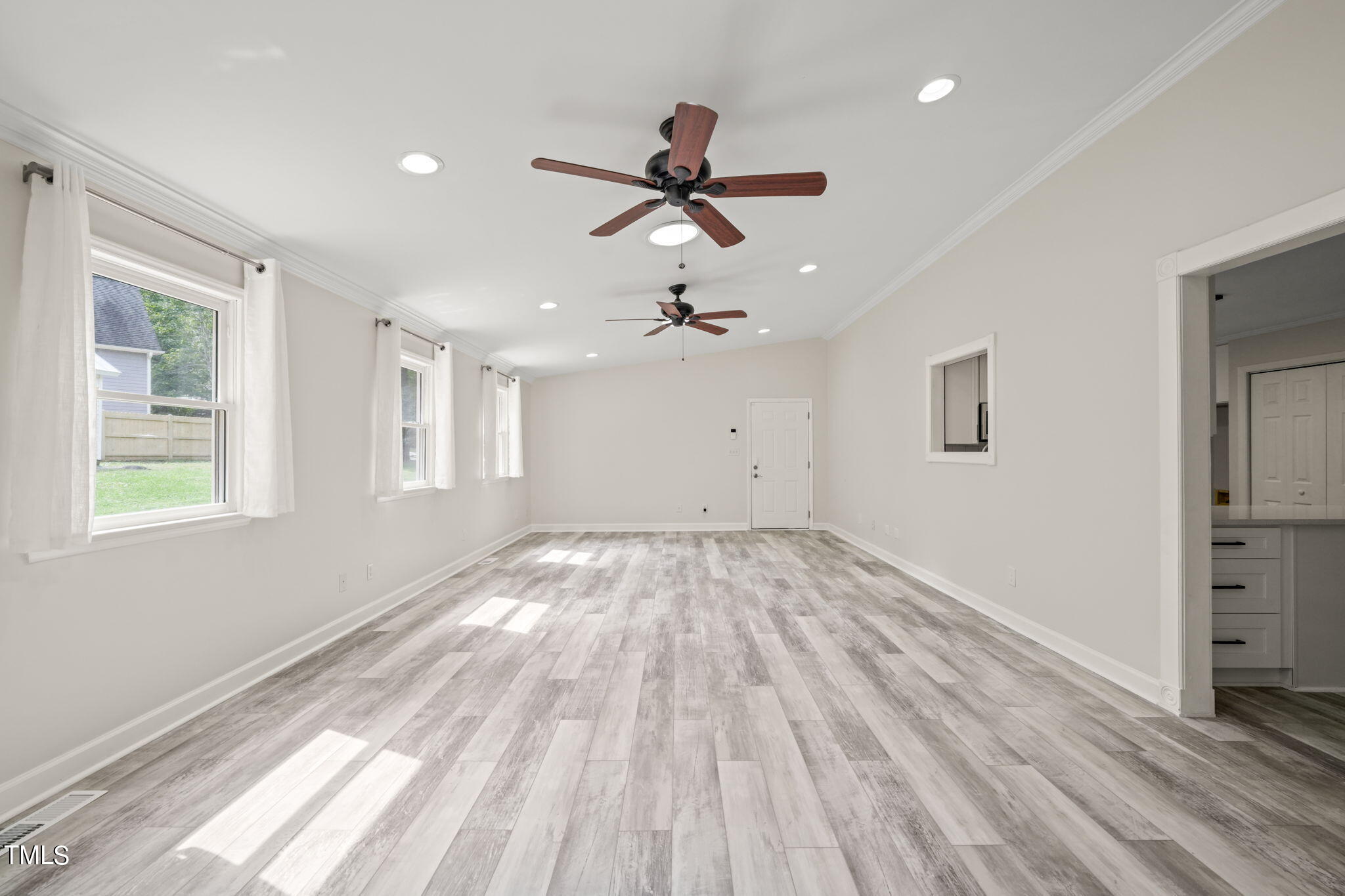 2835 Fox Drive Durham, NC 27712 - Photo 15 of 53 a view of empty room with wooden floor and fan