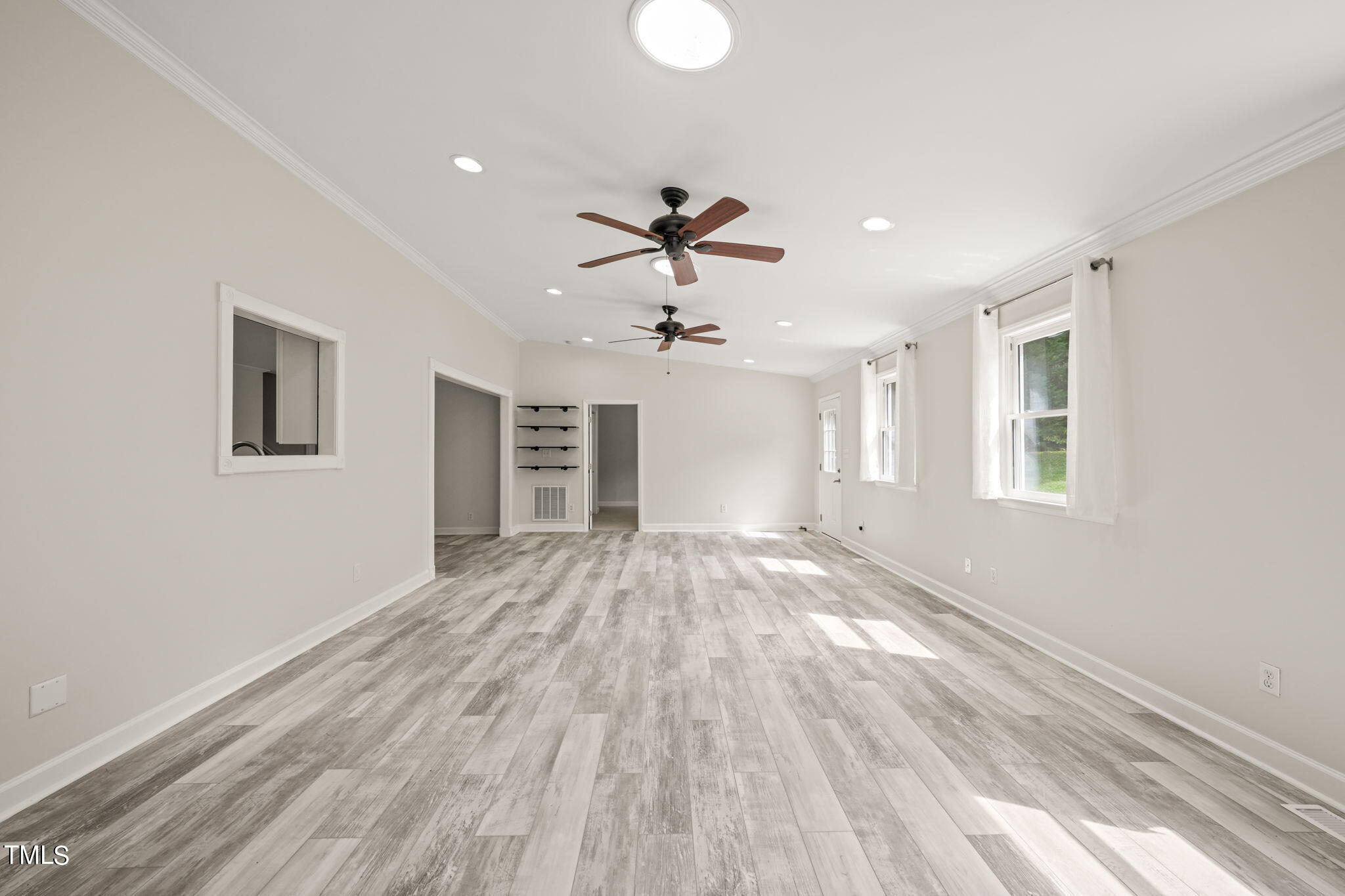 2835 Fox Drive Durham, NC 27712 - Photo 16 of 53 a view of empty room with wooden floor and fan