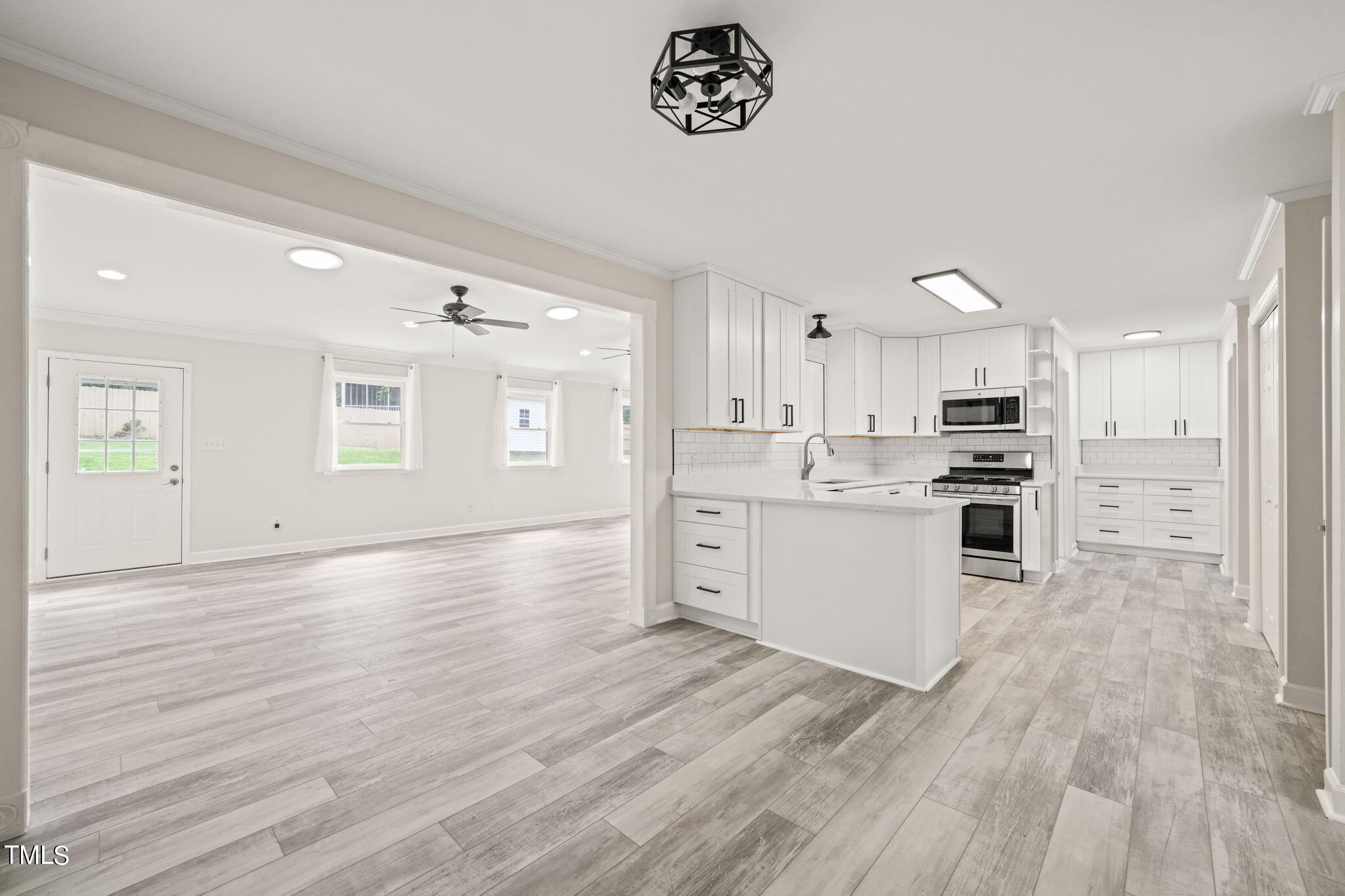 2835 Fox Drive Durham, NC 27712 - Photo 2 of 53 a view of kitchen with wooden floor and electronic appliances
