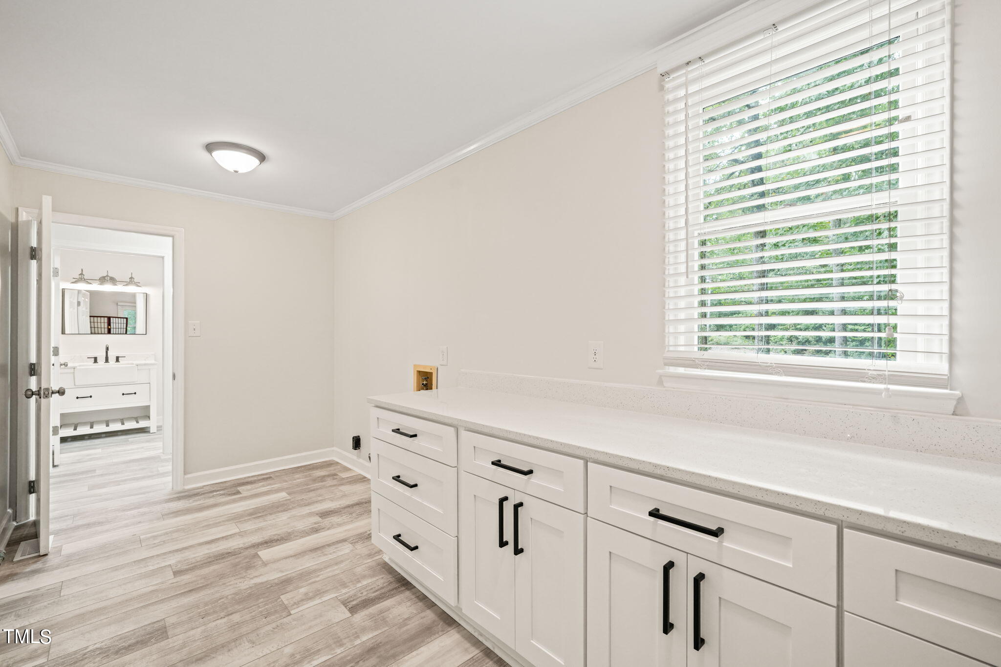 2835 Fox Drive Durham, NC 27712 - Photo 23 of 53 a kitchen with granite countertop white cabinets and window