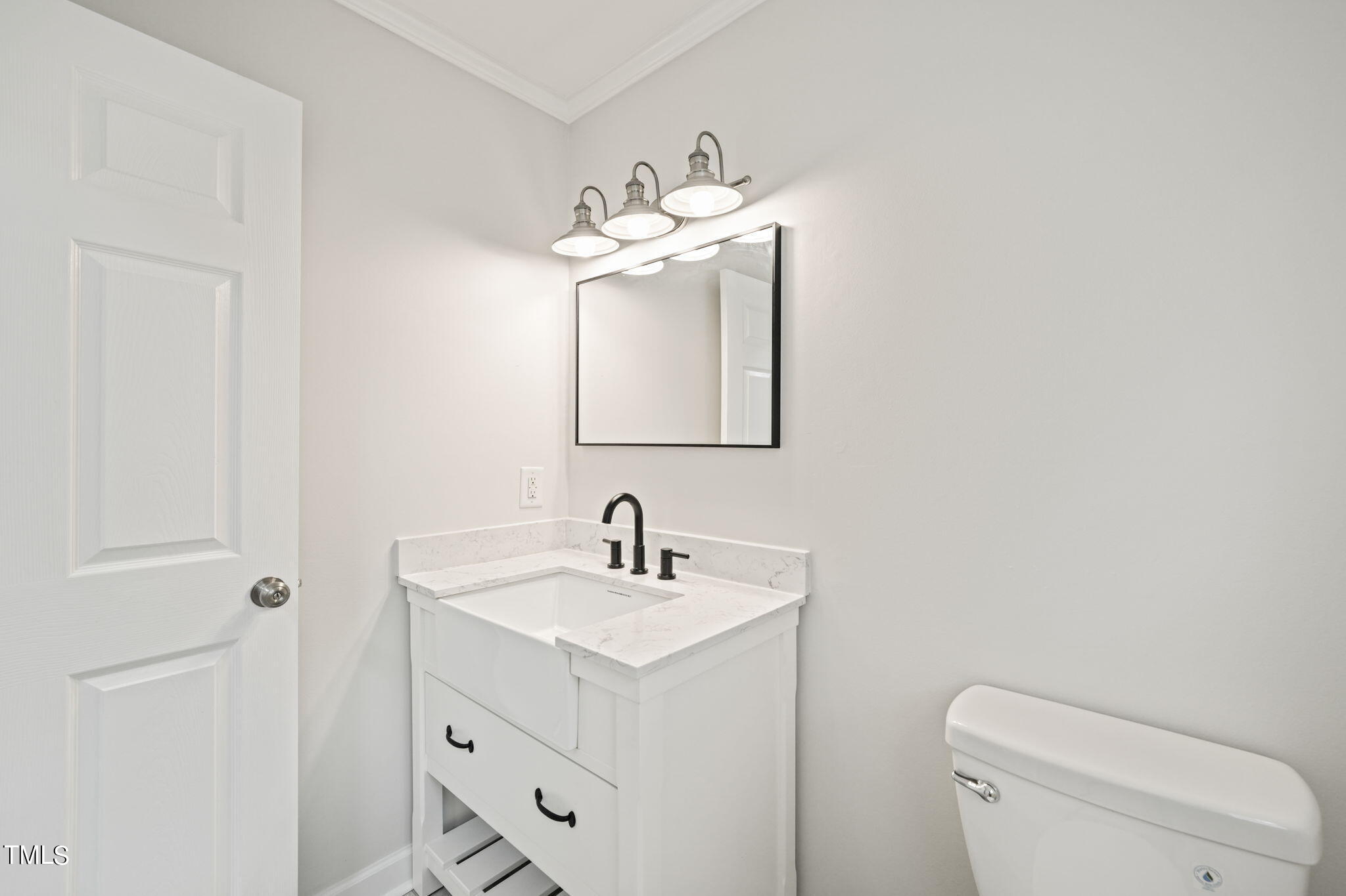 2835 Fox Drive Durham, NC 27712 - Photo 24 of 53 a bathroom with a sink a toilet and mirror