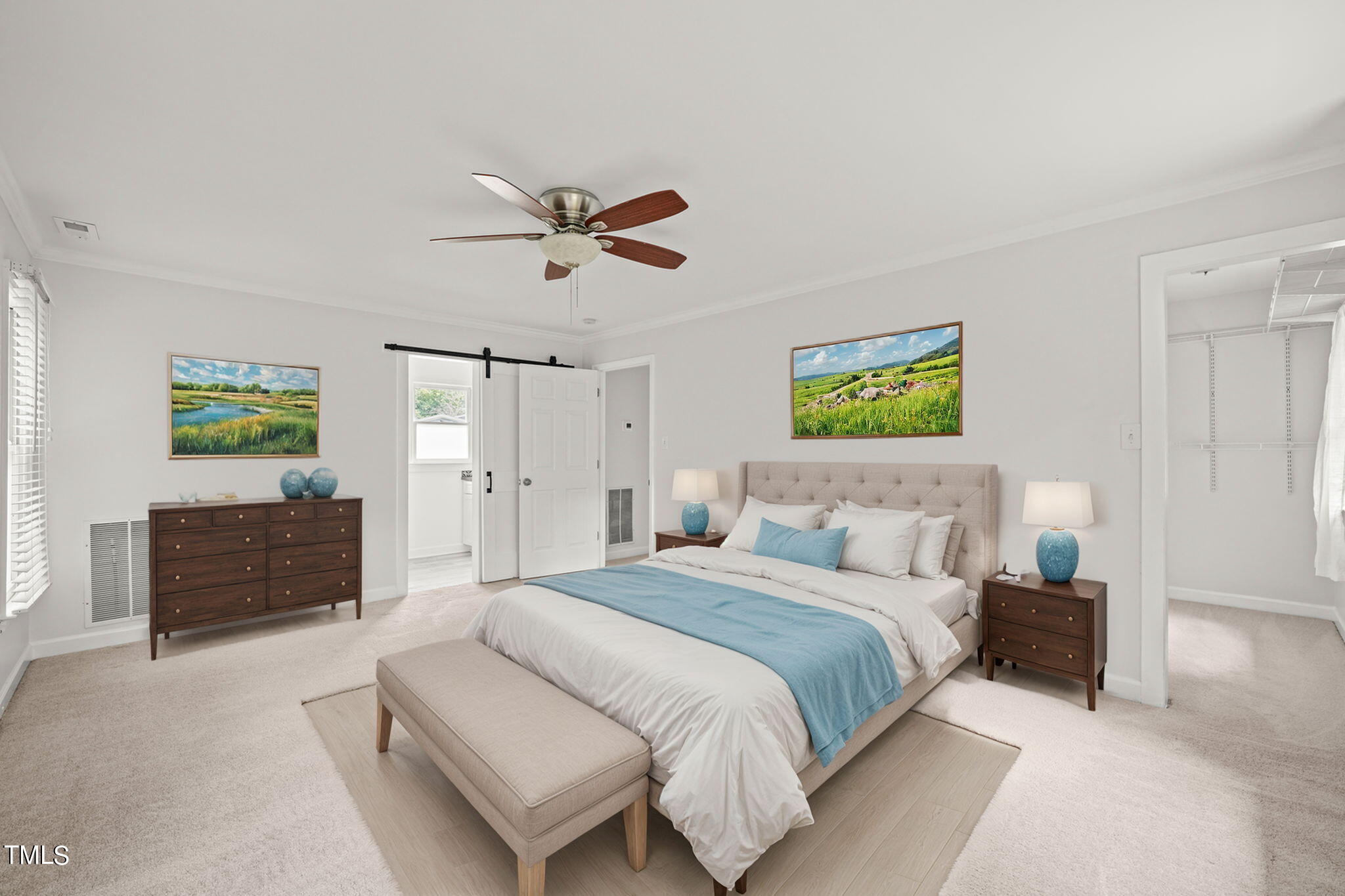 2835 Fox Drive Durham, NC 27712 - Photo 28 of 53 a spacious bedroom with a bed a dresser and a chandelier