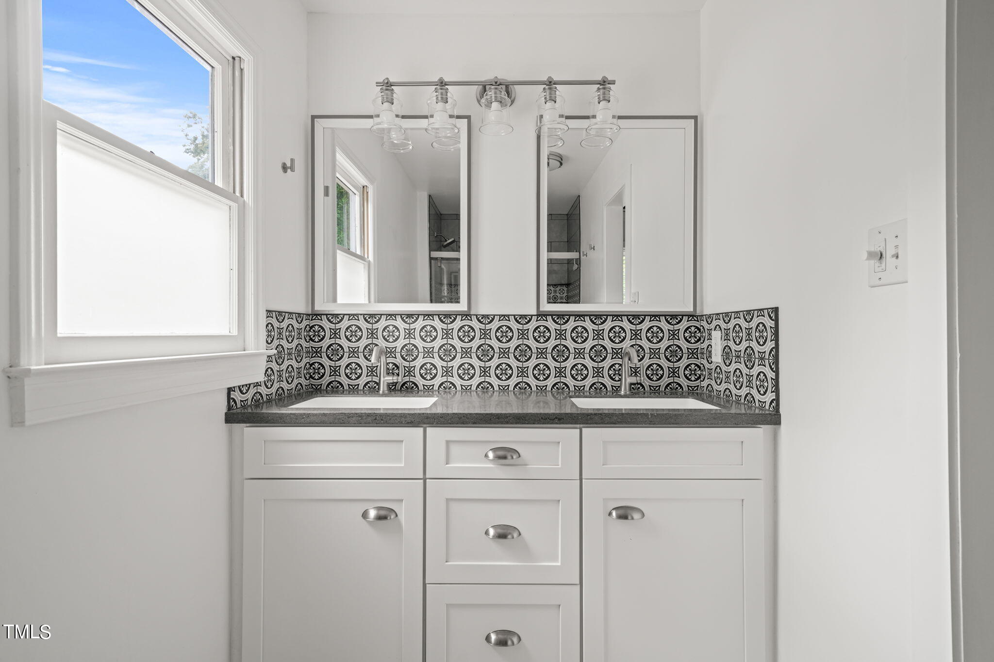 2835 Fox Drive Durham, NC 27712 - Photo 31 of 53 a bathroom with a granite countertop sink and a mirror