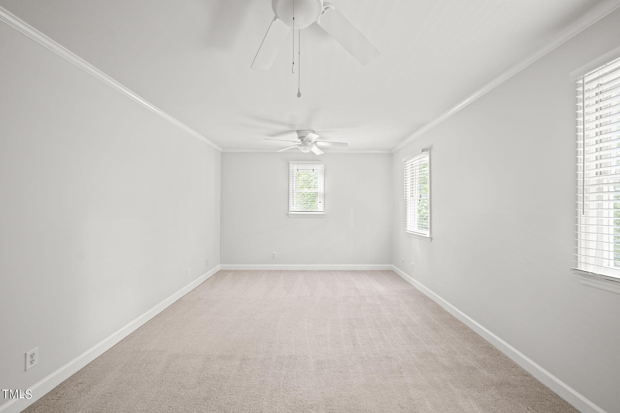 2835 Fox Drive Durham, NC 27712 - Photo 36 of 53 an empty room with windows and chandelier fan