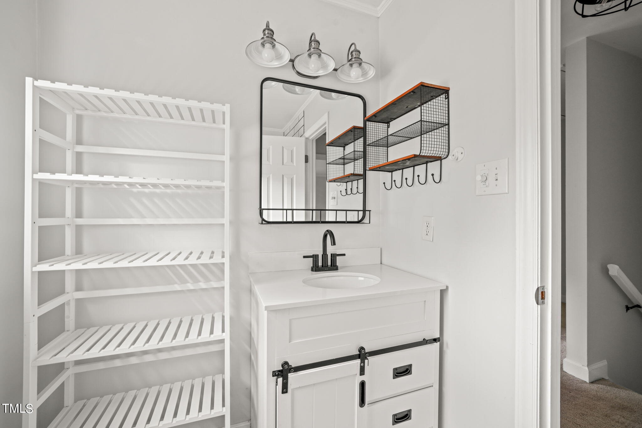 2835 Fox Drive Durham, NC 27712 - Photo 38 of 53 a bathroom with a sink and a mirror