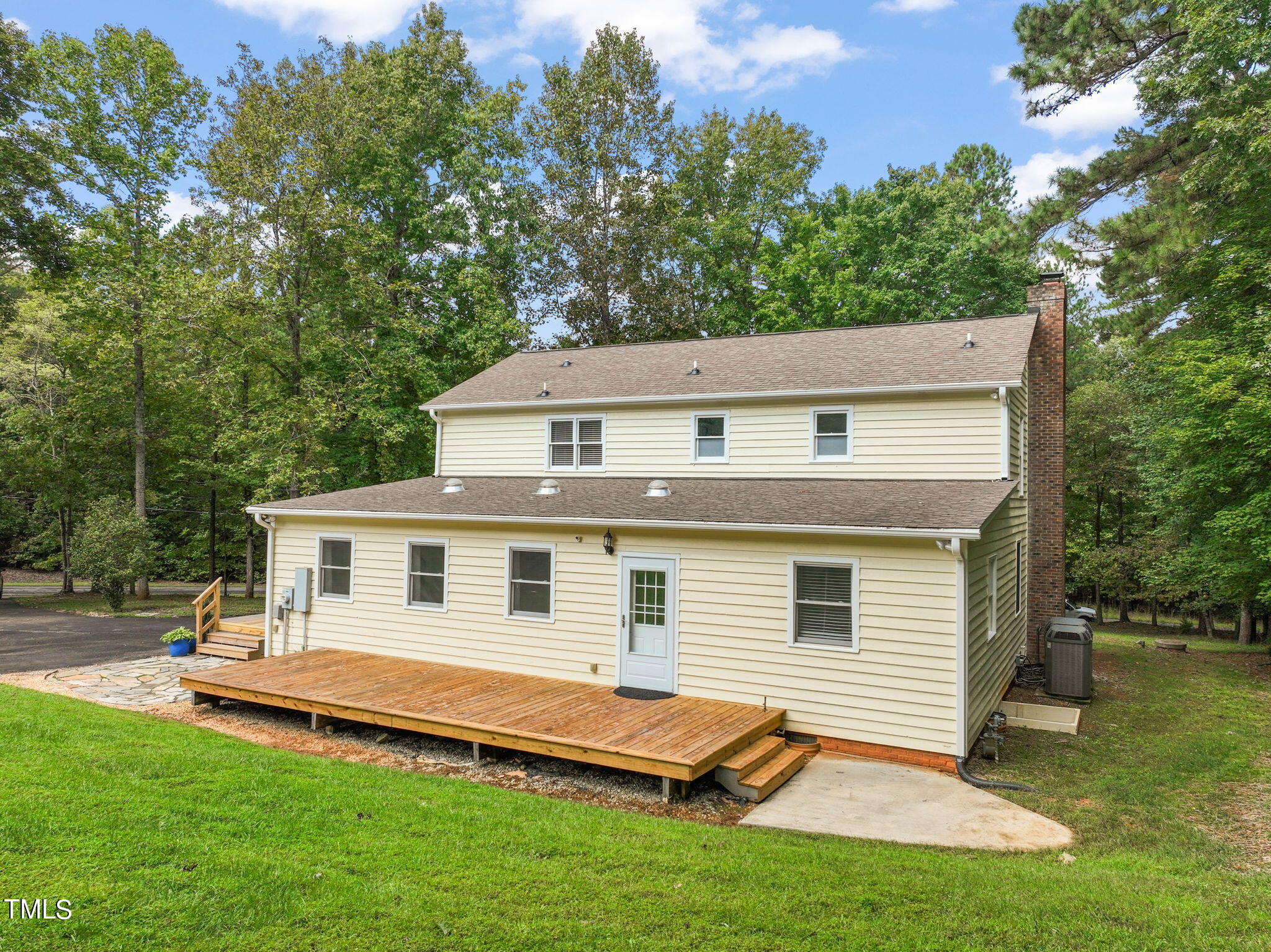 2835 Fox Drive Durham, NC 27712 - Photo 44 of 53 a view of a white house with a big yard and a large tree